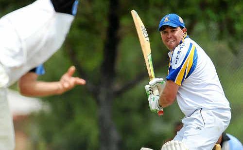 Chris Neal guides his eye toward this delivery and prepares to despatch it to the outfield. Chris Neal guides his eye toward this delivery and prepares to despatch it to the outfield.